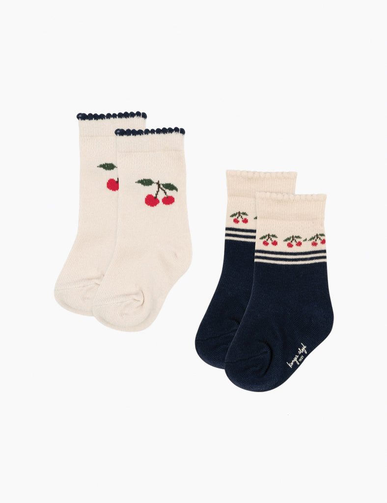Two pairs of socks with cherry design on a white background