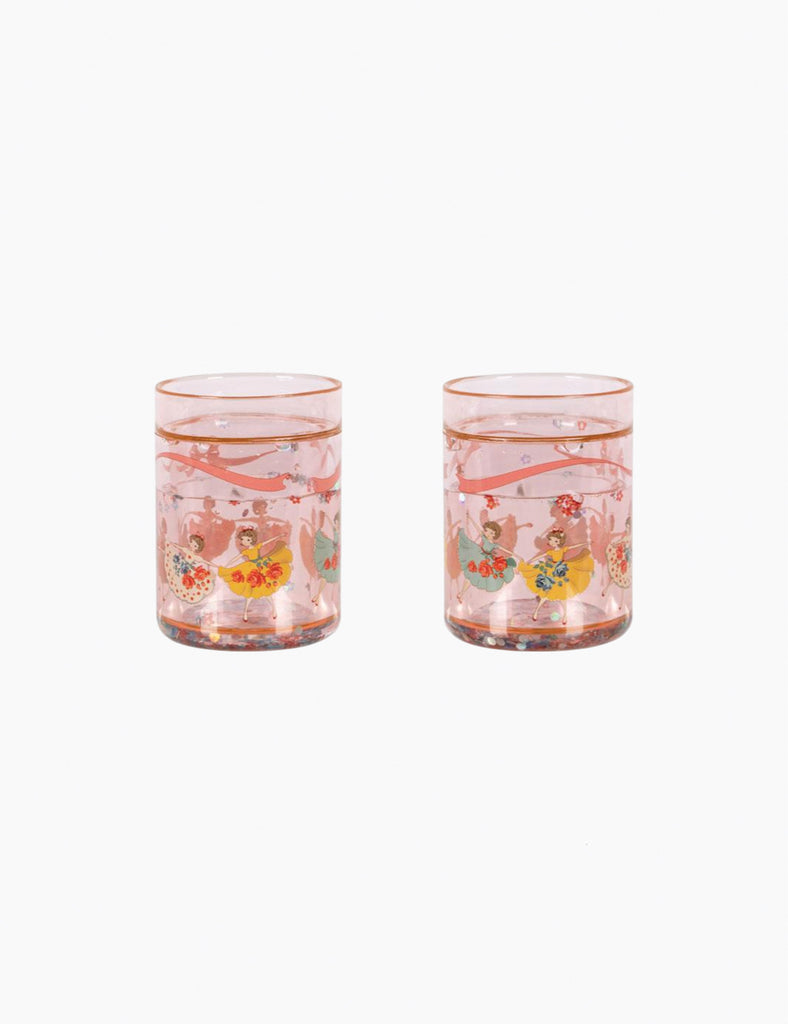 Two pink glass tumblers with floral designs on a white background