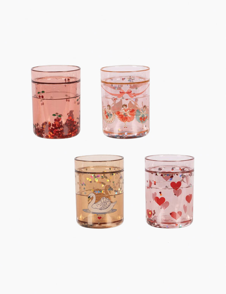Set of four decorative glasses with floral and heart patterns on a white background