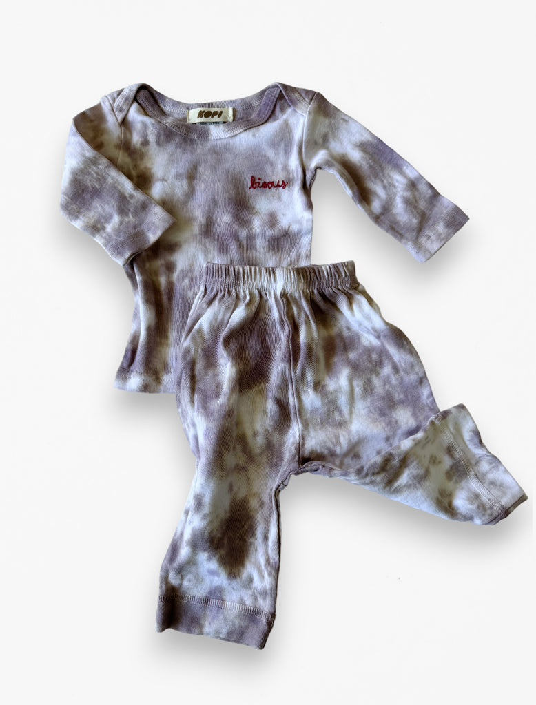 90s tie dye set with bisous embroidery flat lay image.