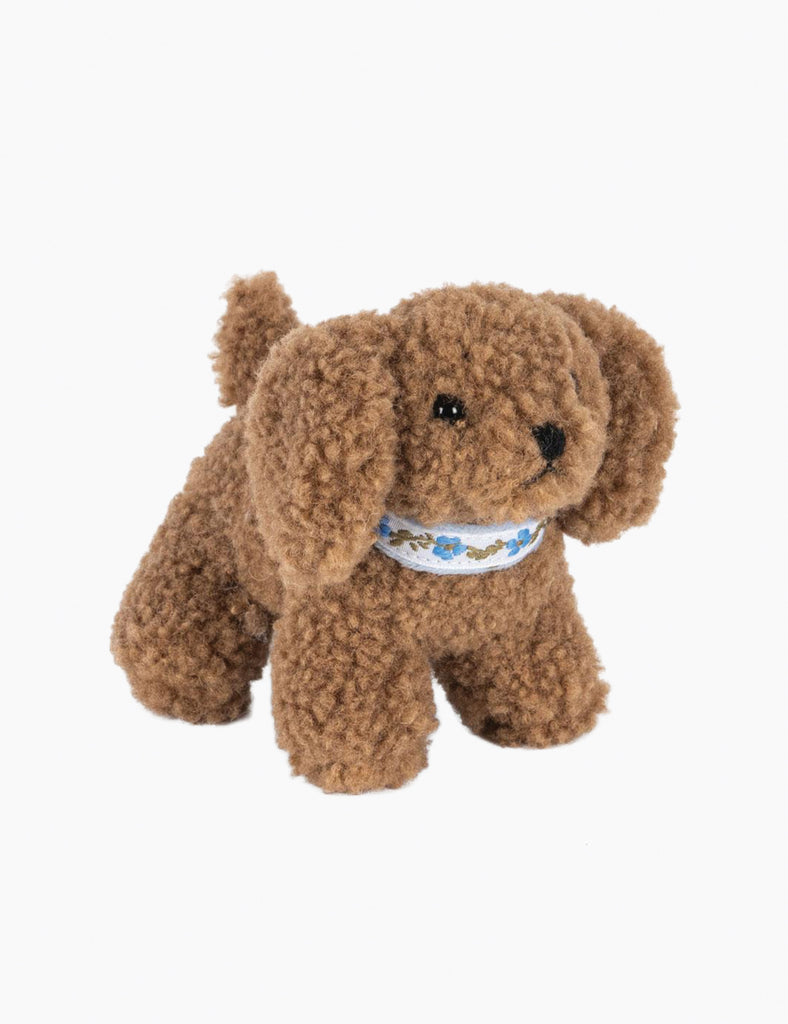 Brown plush dog toy with a white collar on a white background