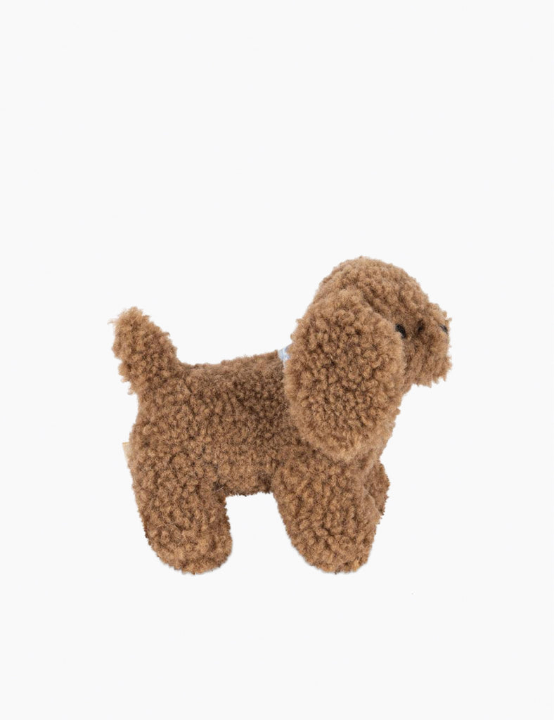 Brown plush dog toy on a white background