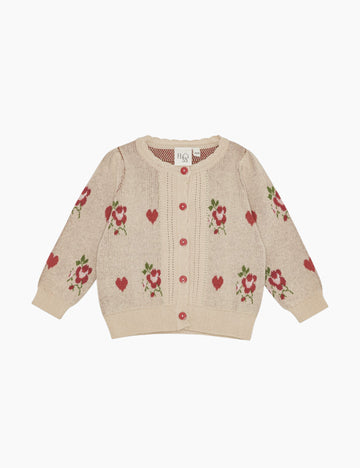 Beige cardigan with floral and heart patterns on a white background