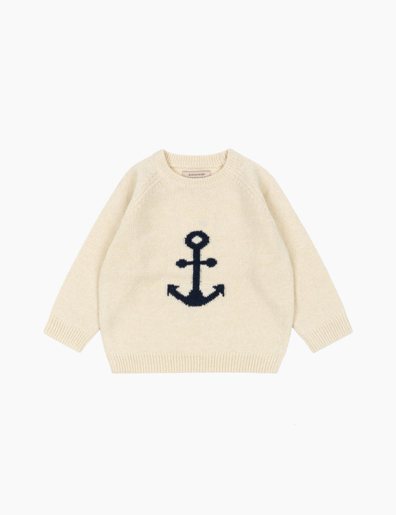 Beige sweater with a navy anchor design on a white background