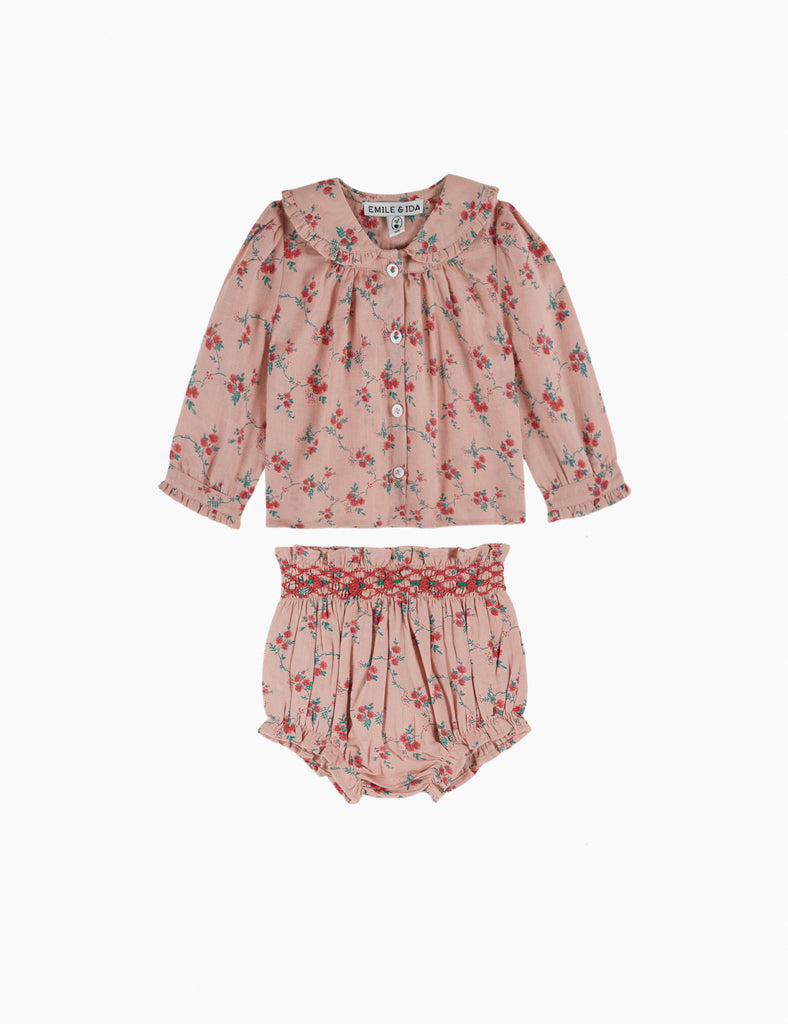 Floral baby outfit with top and bloomers on a white background