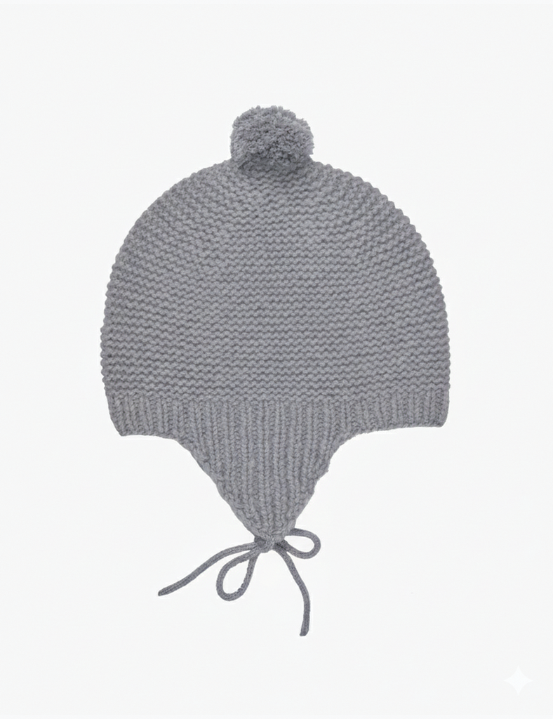 Gray knitted baby hat with a pom-pom on a white background