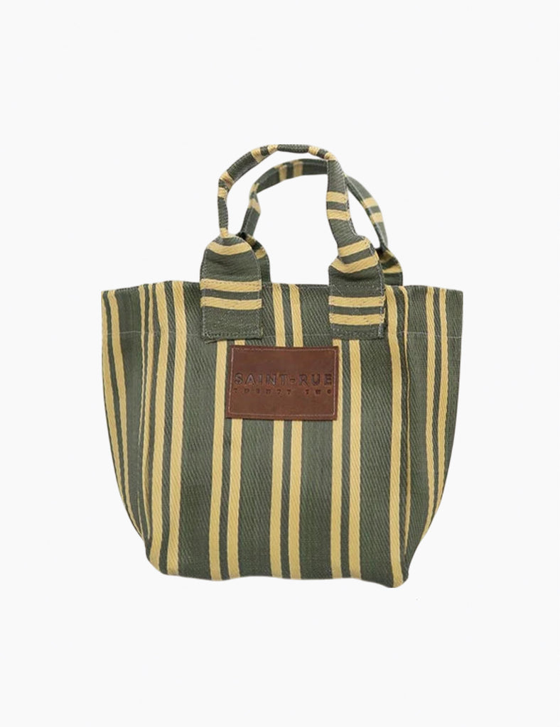 Image of a stripe bag with leather branding on a white background