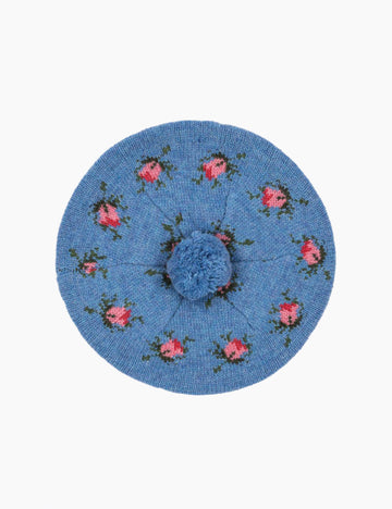 Blue beret with floral embroidery on a white background