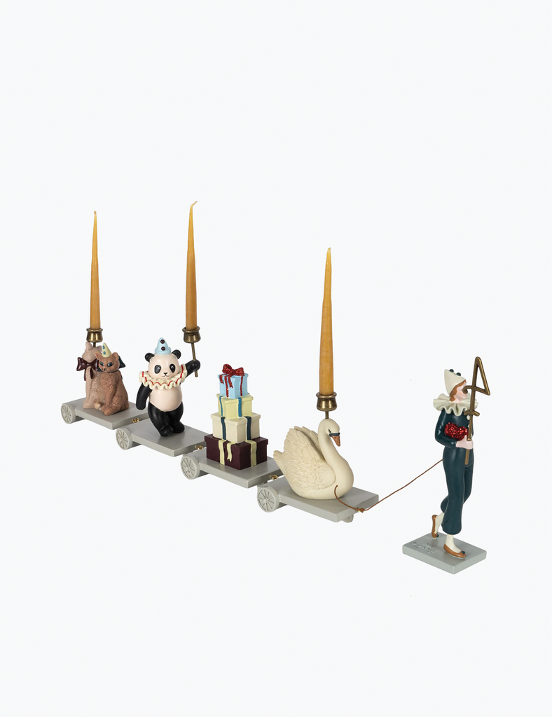 Decorative set with figurines and candles on a white background