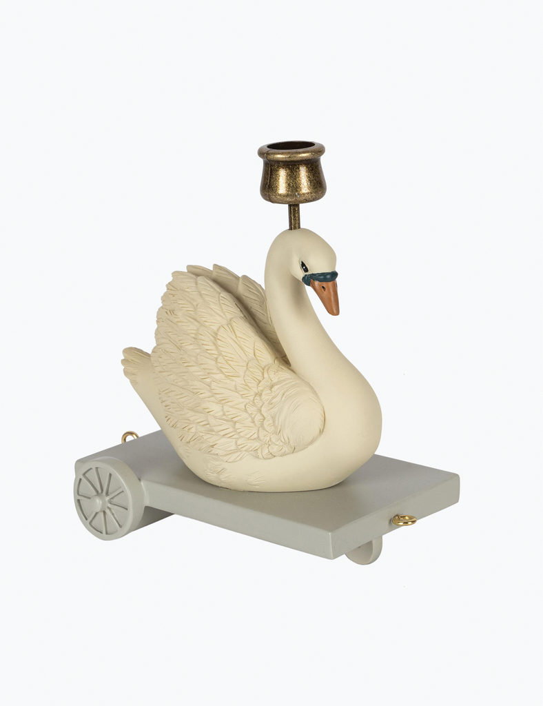 Decorative swan figure with a candle holder on a white background