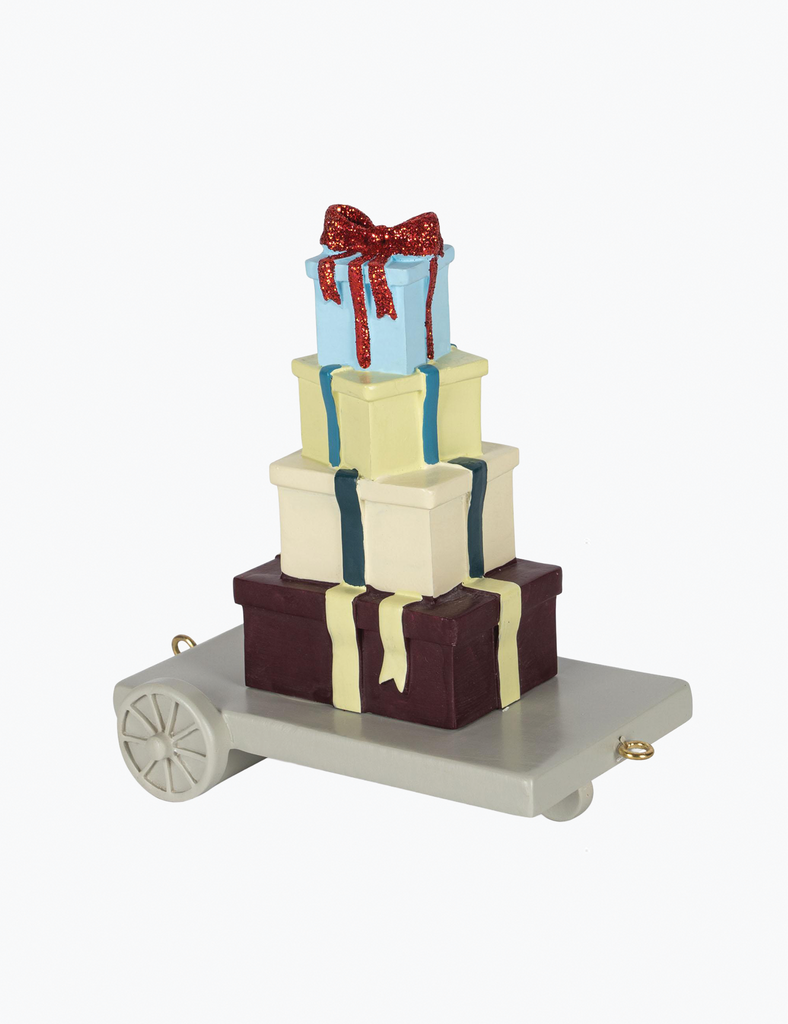 Decorative ornament of stacked gift boxes with ribbons on a white background