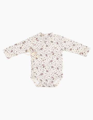 Floral-patterned baby onesie on a white background