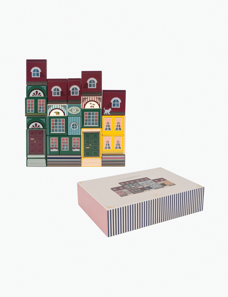 Decorative box with a colorful building design on top and striped pattern on the side.