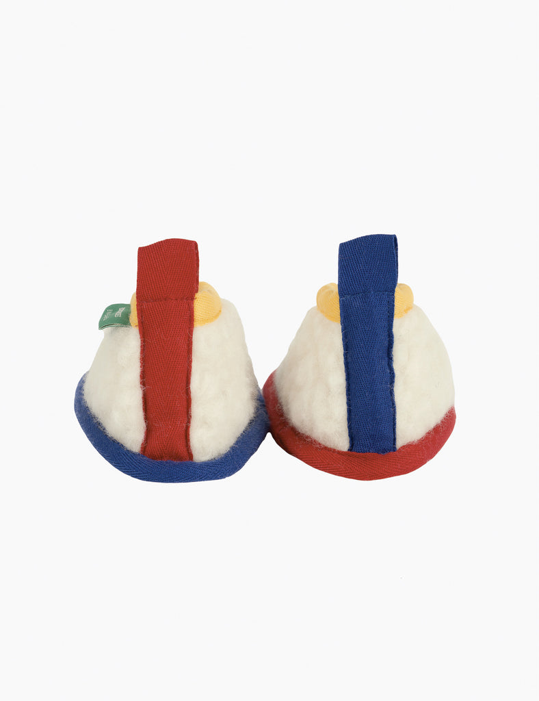 Two plush toys resembling traditional Japanese rice balls on a white background