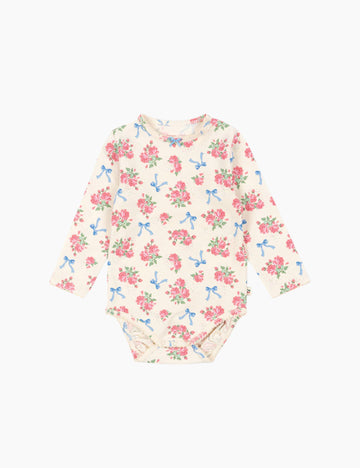 Image of a baby long sleeve bodysuit with a floral and bow print.
