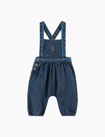 Blue denim overalls with embroidered design on a white background