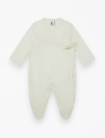 Baby Wrap Sleepsuit in Cream Pointelle flat lay image.