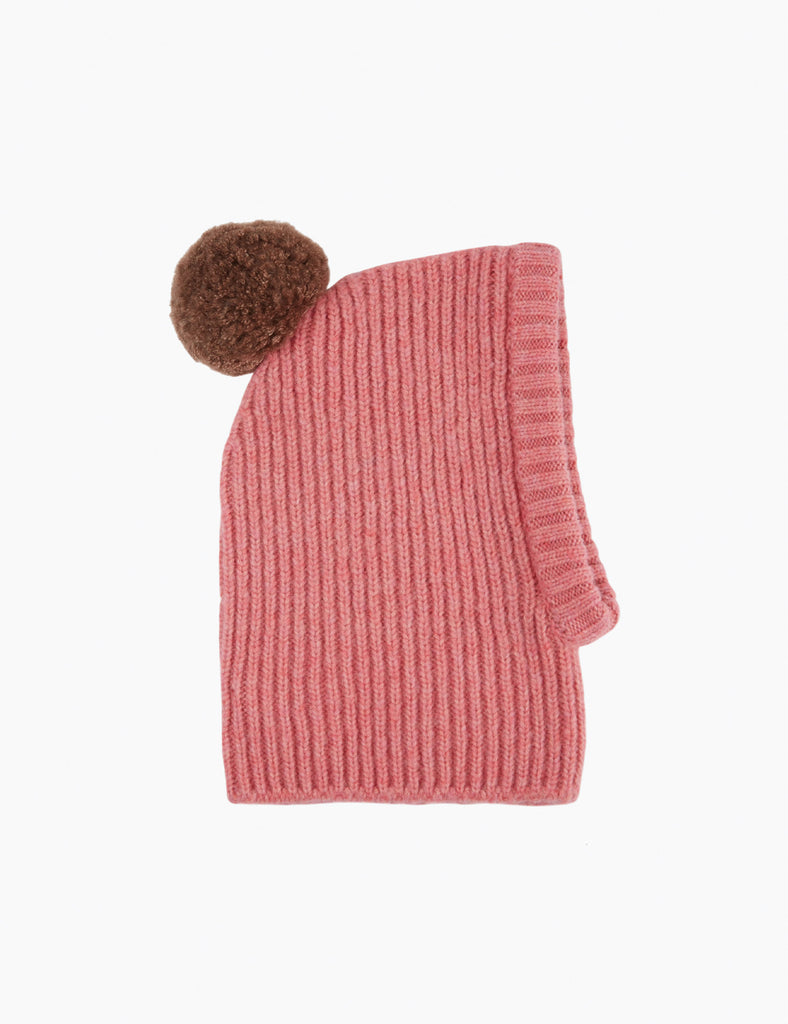 Pink knitted hood with brown pom-pom on a white background