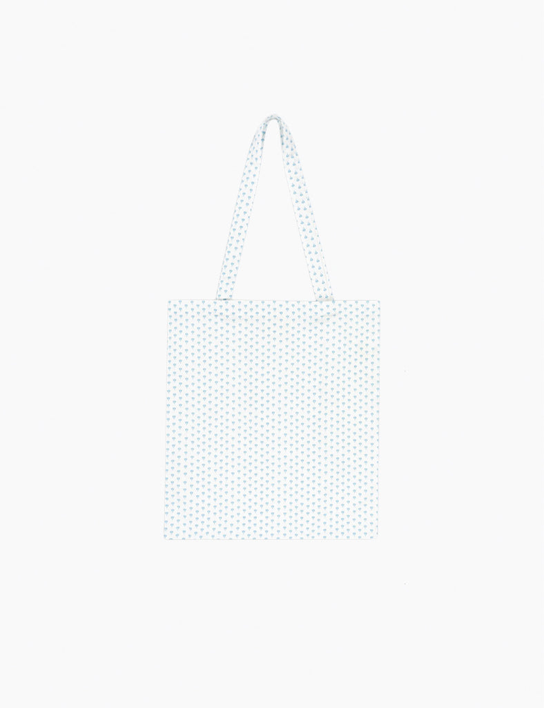 Bedding tote bag with subtle blue print on a white background