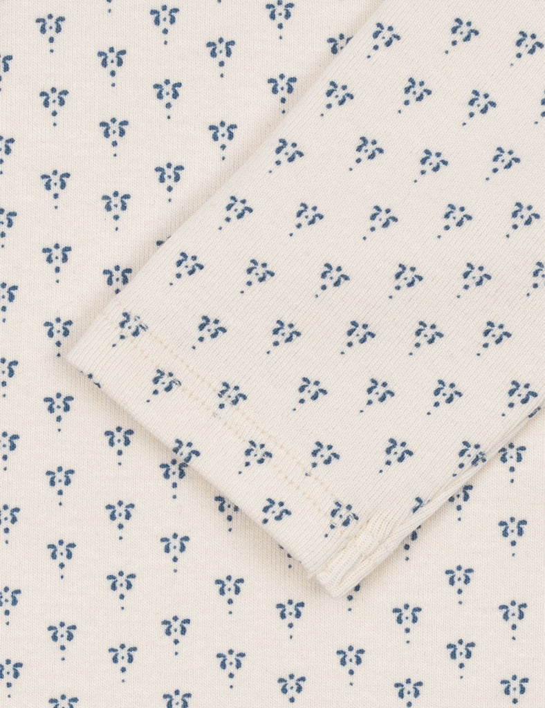Folded fabric with blue floral pattern on a white background