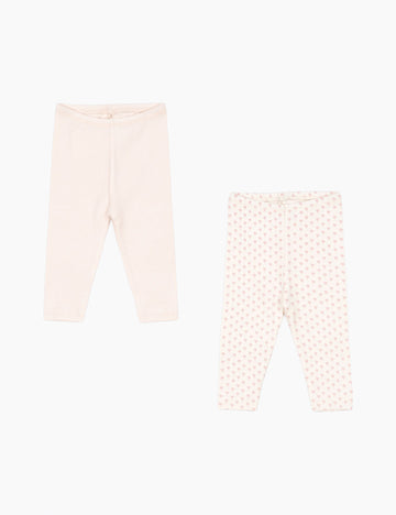 Two pairs of baby leggings on a white background