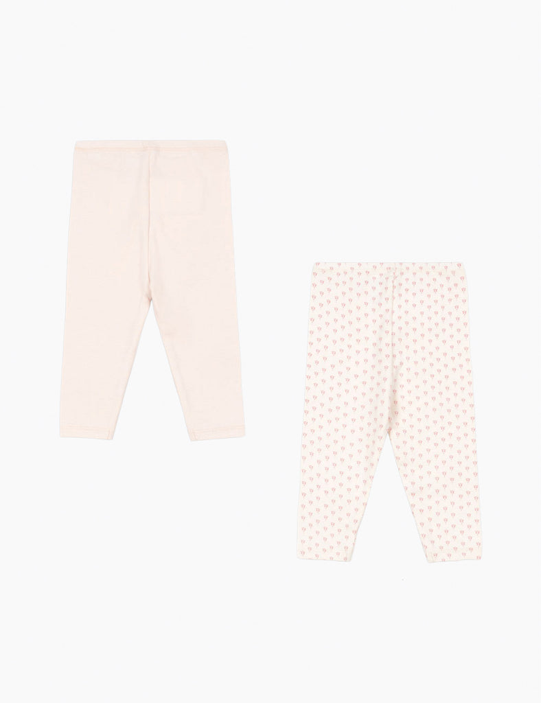 Two pairs of leggings, one plain pink and one with a subtle pattern, on a white background.