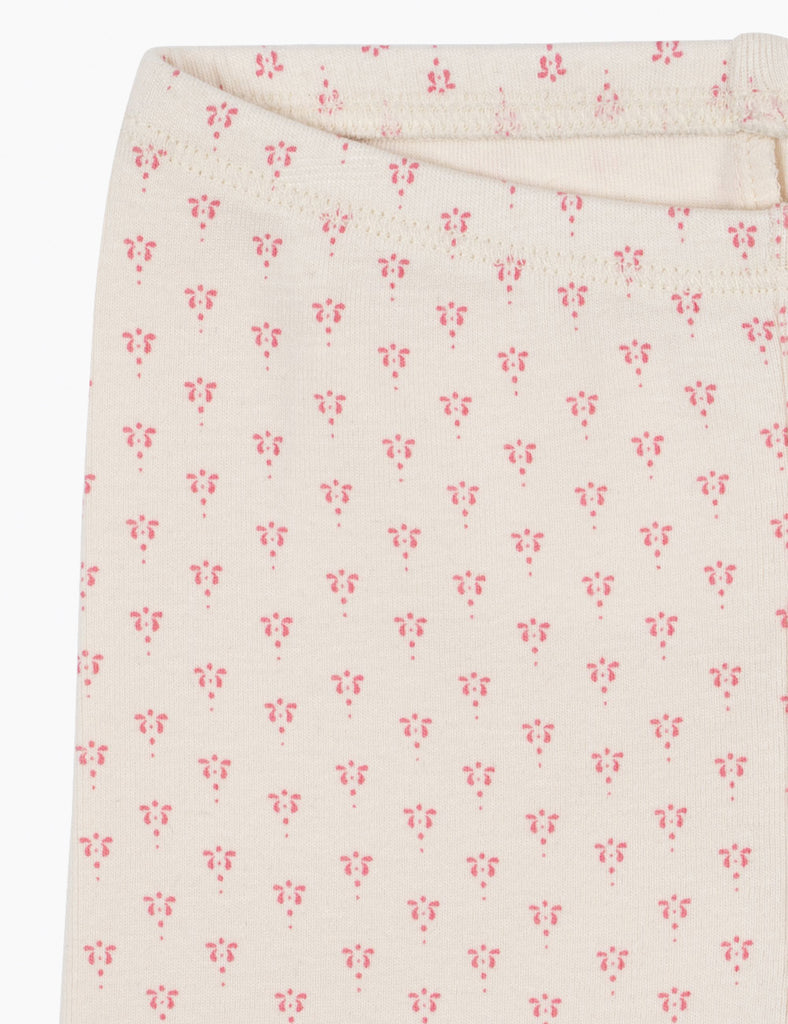 Floral patterned fabric with small pink flowers on a white background