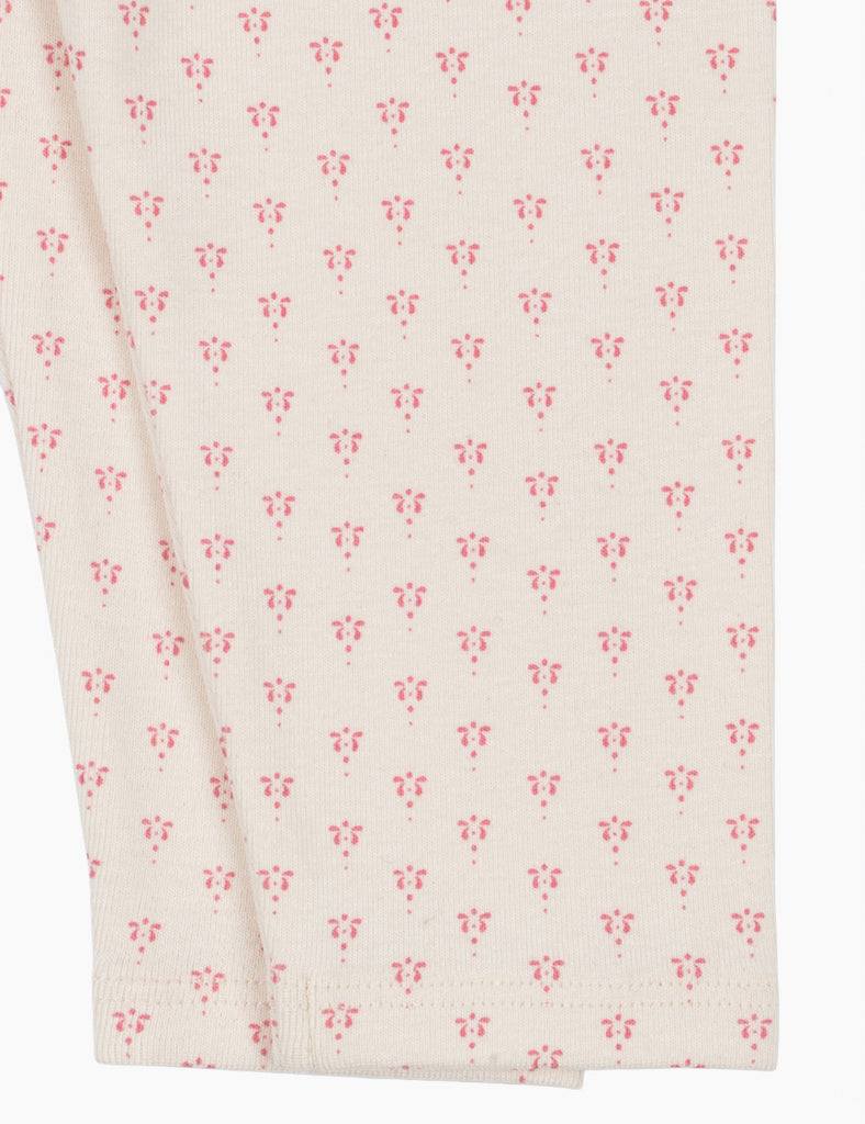 White fabric with small pink floral pattern
