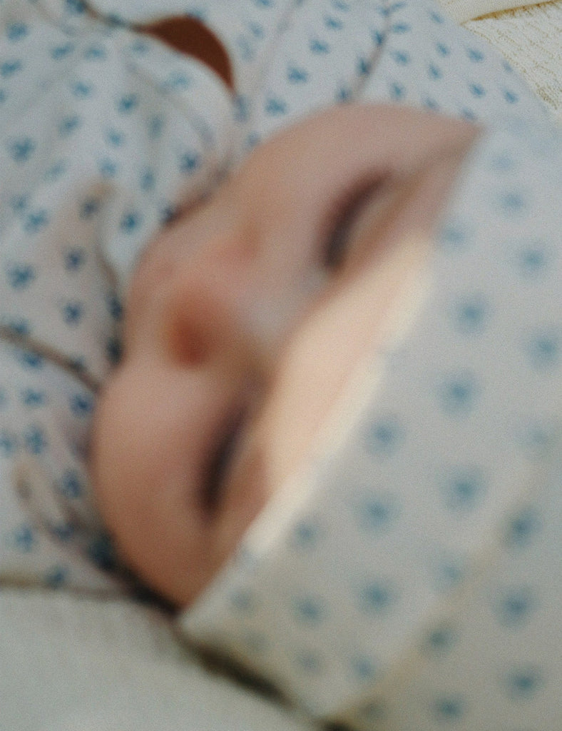 Close-up of a baby wearing a patterned outfit