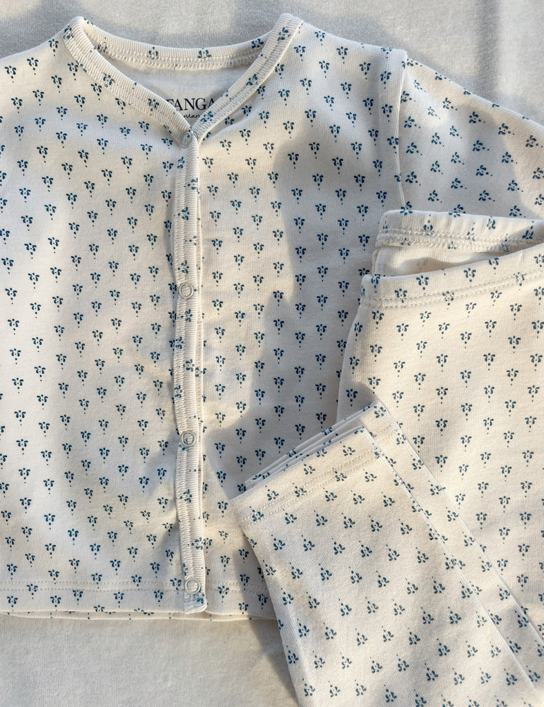 Baby outfit with blue floral pattern on a light background