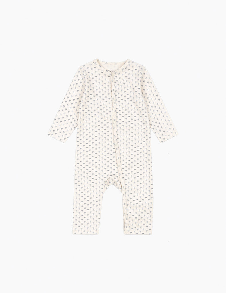 White baby onesie with small patterns on a white background