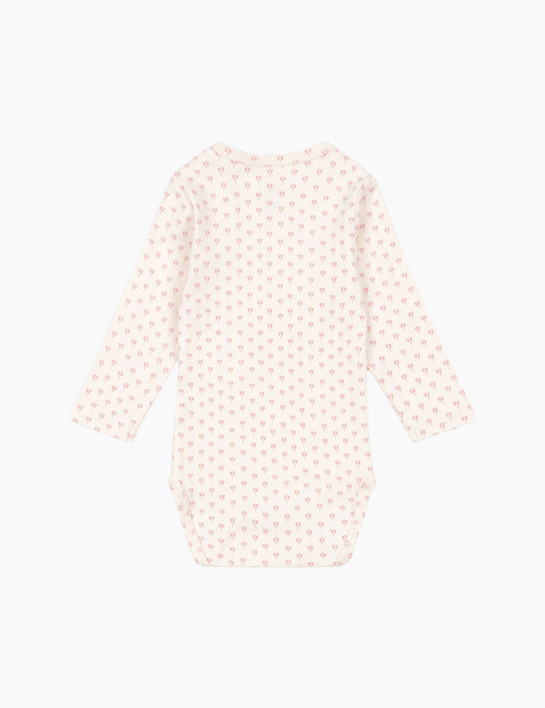 Baby onesie with a subtle pattern on a white background