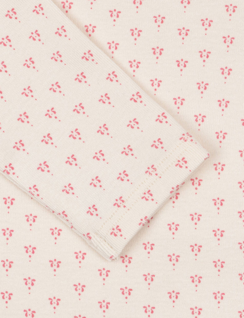 Floral patterned fabric with pink flowers on a white background
