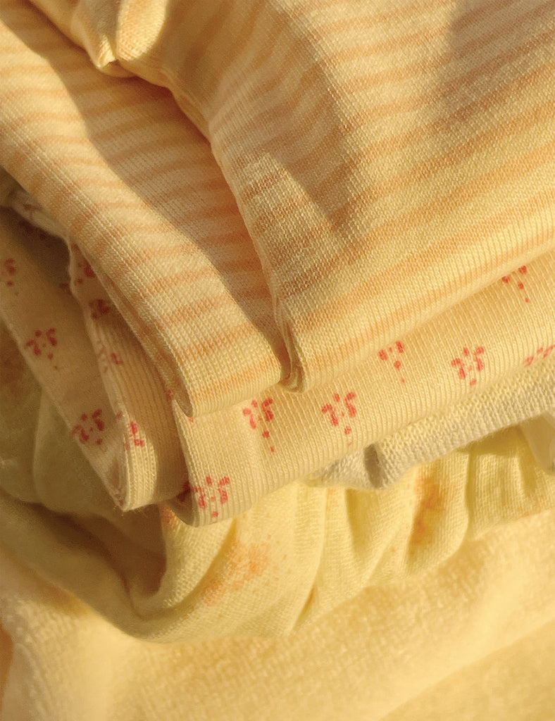 Close-up of yellow fabric with subtle pattern
