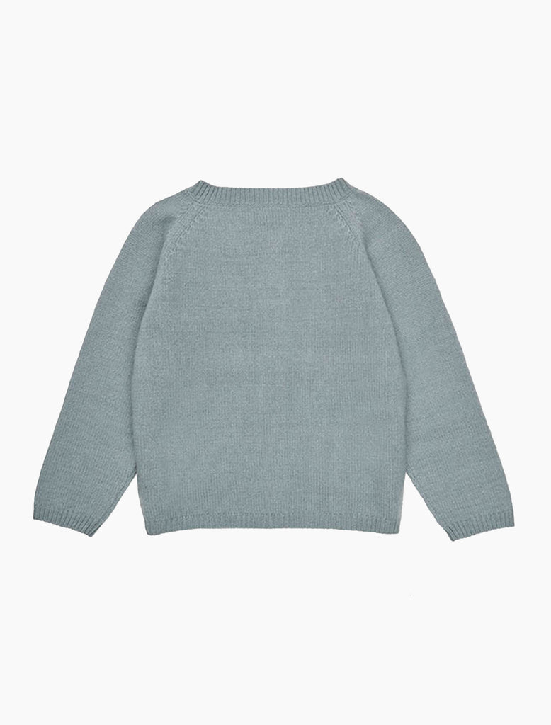 Light blue knitted sweater on a white background