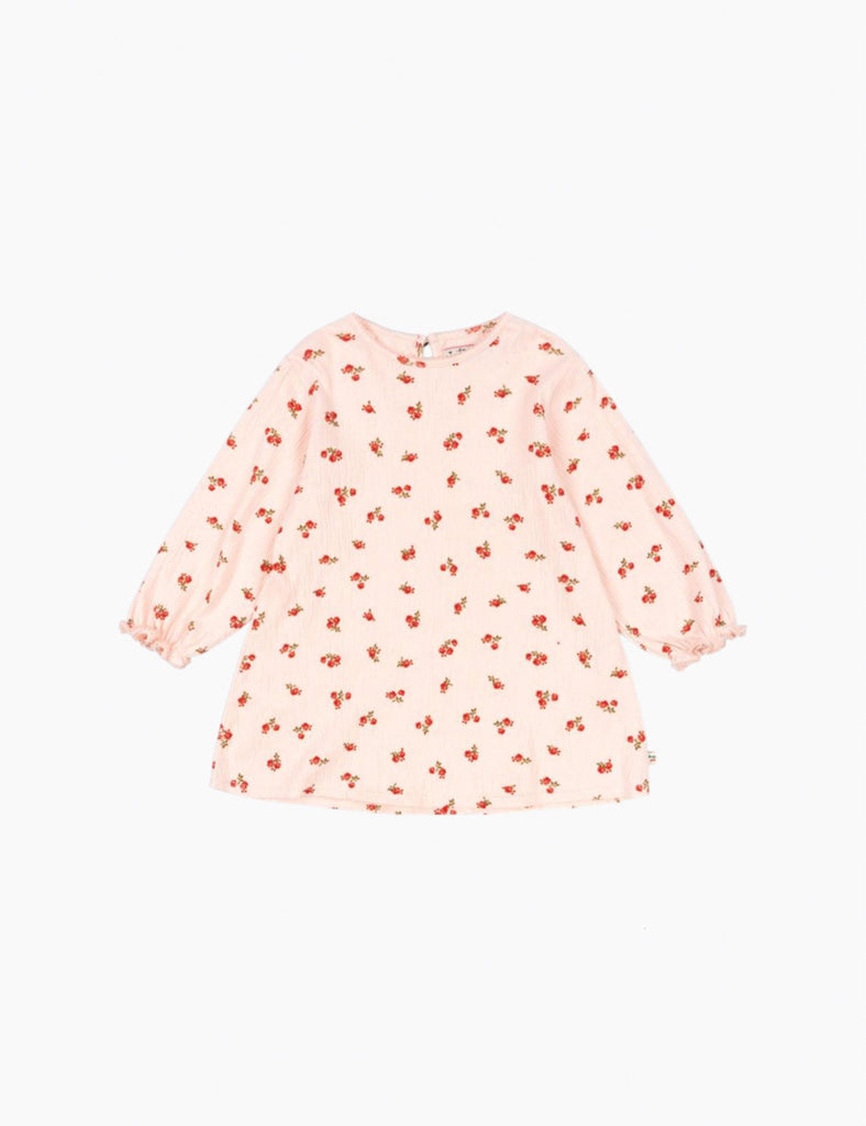 Pink dress with red floral pattern on a white background