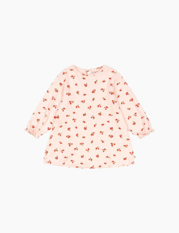 Pink dress with red floral pattern on a white background