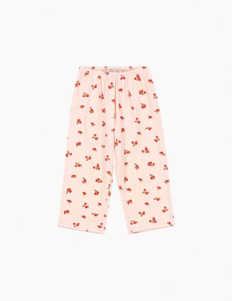 Pink pajama pants with red floral pattern on a white background
