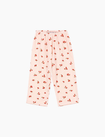 Pink pajama pants with red floral pattern on a white background