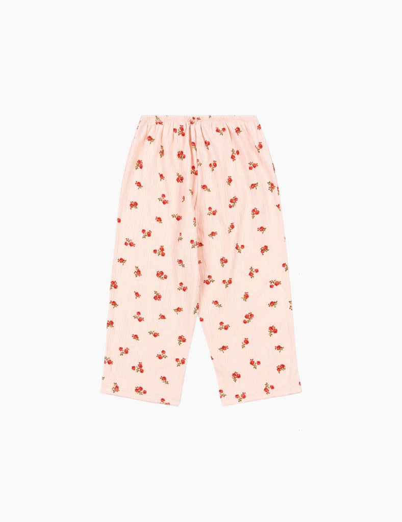 Pink floral pajama pants on a white background