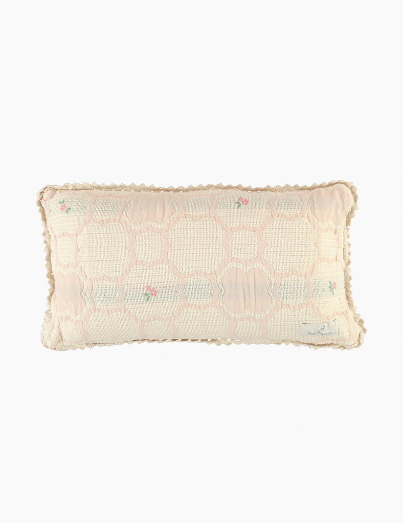 Rectangular pillow with textured cover on a white background