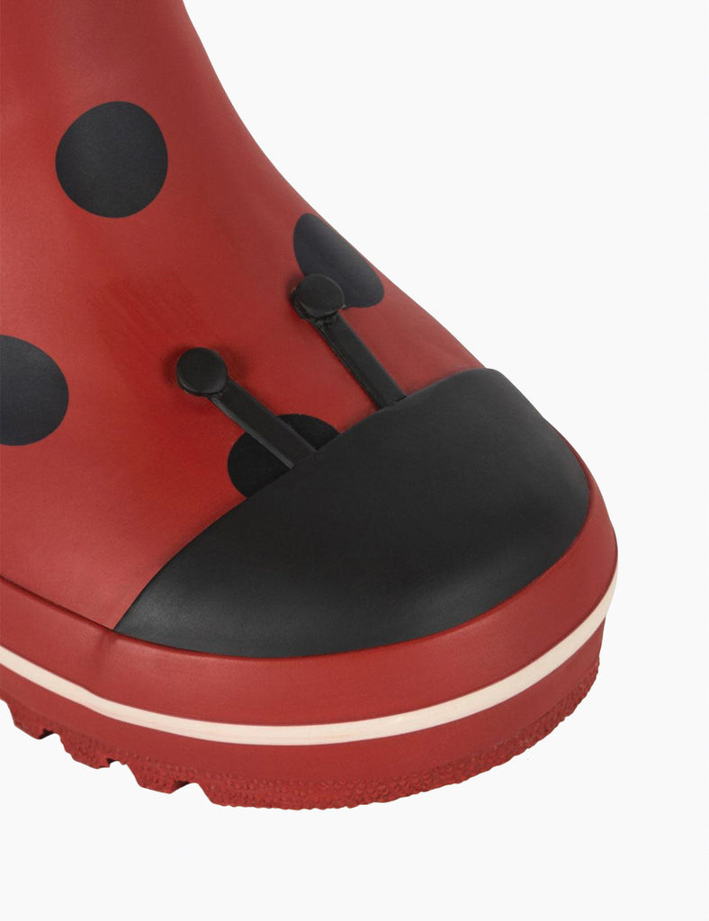 Image of child's rainboots with an allover ladybug print on a white background.