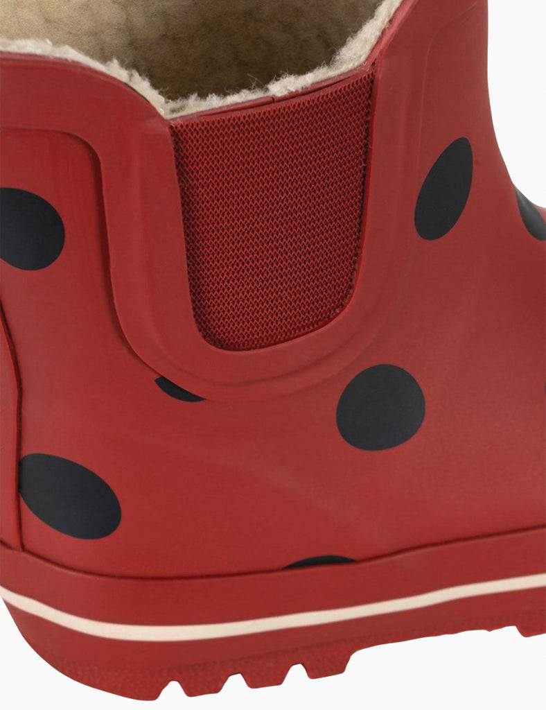 Image of child's rainboots with an allover ladybug print on a white background.