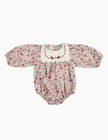 Floral baby romper on a white background