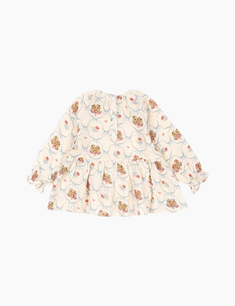 Printed puppy print on a cotton peplum top.
