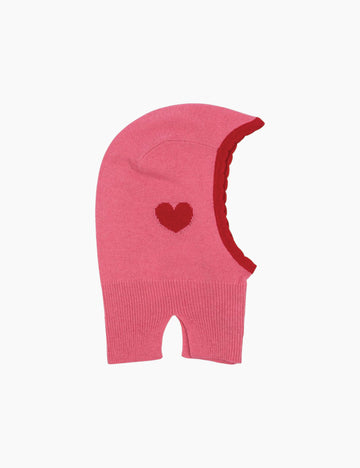 Pink knitted balaclava with a red heart on a white background