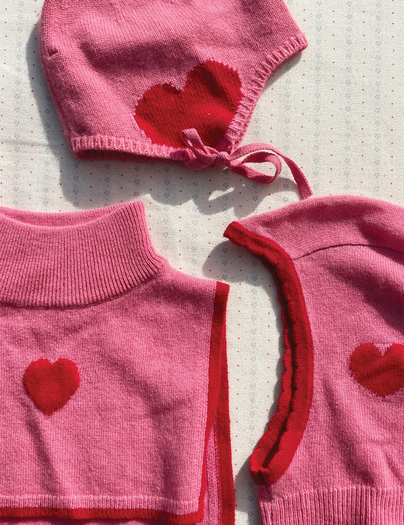 Images of pink knitted pieces laying flat on a printed background.