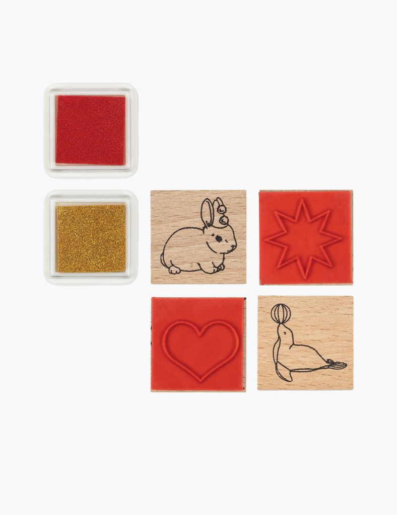 Set of wooden stamps with various designs on a white background