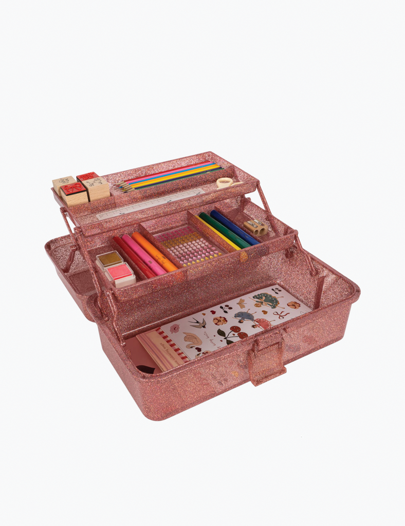 Pink pencil case with stationery items on a white background