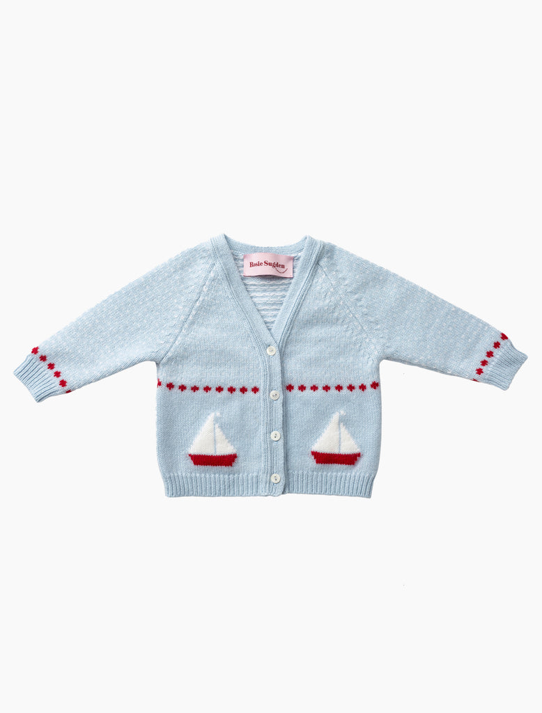 Light blue baby cardigan with sailboat designs on a white background